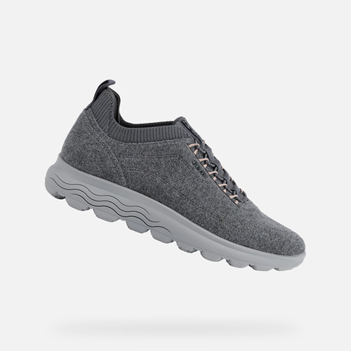 Dark grey sports shoes with a textured upper, featuring a lace-up design and cushioned sole, designed for women in size UK 4 by Geox.