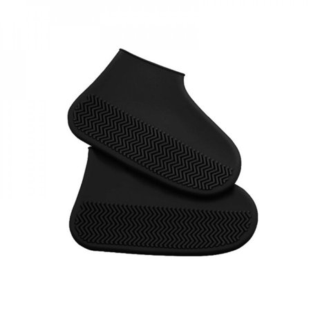 Black junior trousers by Gilbert Rugby, made from durable material, featuring an elastic waistband and a sleek, streamlined design suitable for active wear.