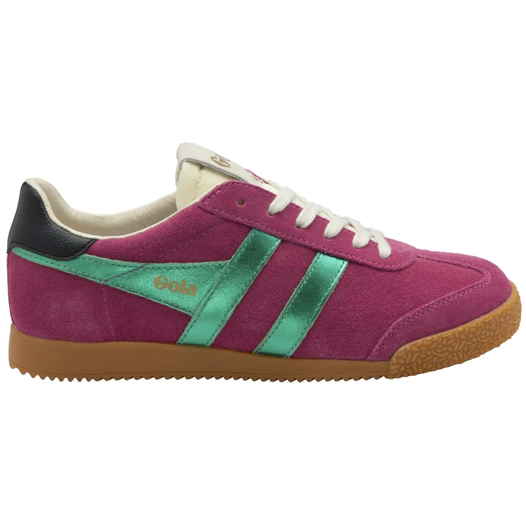 Fuchsia suede trainers with emerald green stripes and black heel, featuring a textured gum sole and white laces, showcasing a retro athletic design.