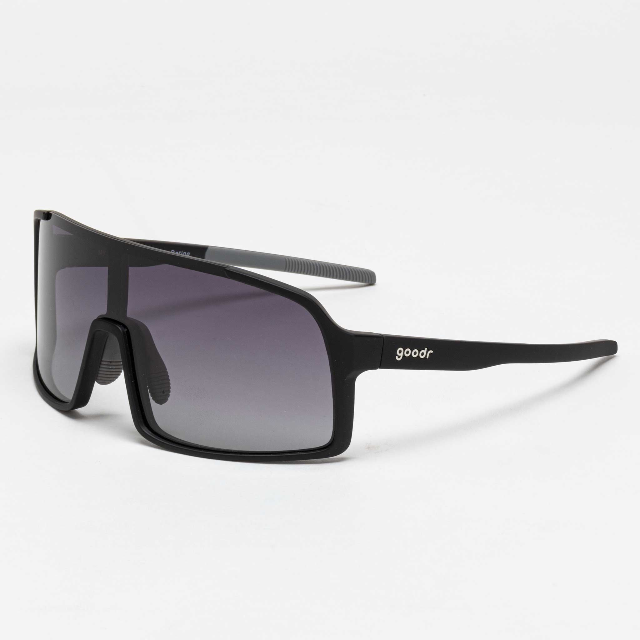 Black Goodr sunglasses with a sleek design, featuring a wide frame and gradient lenses, labeled "My Sweat Has an Octane Rating" on the side.