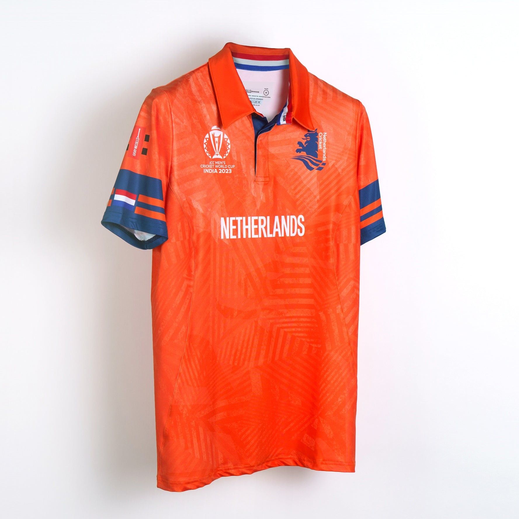 Orange women's cricket match shirt featuring the Netherlands logo, blue sleeves with stripes, and a textured pattern, designed for the CWC23 tournament.