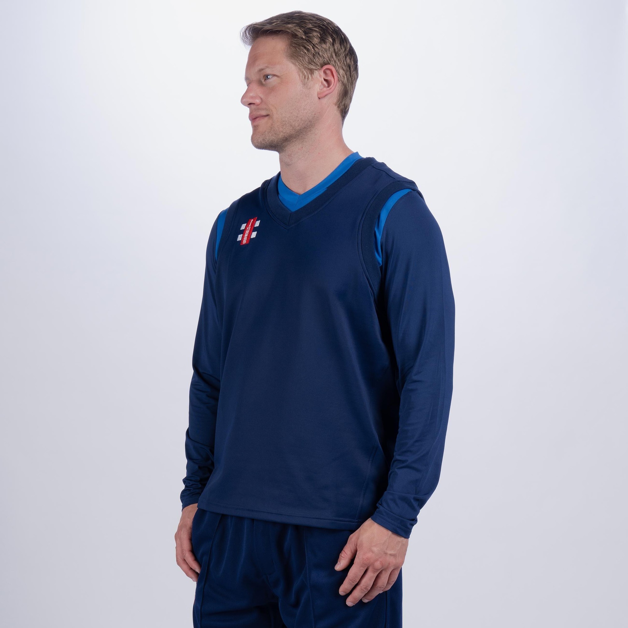 Black Gray-Nicolls Pro Performance adult slipover featuring a V-neck design, long sleeves, and a sporty fit, made from lightweight, breathable material.