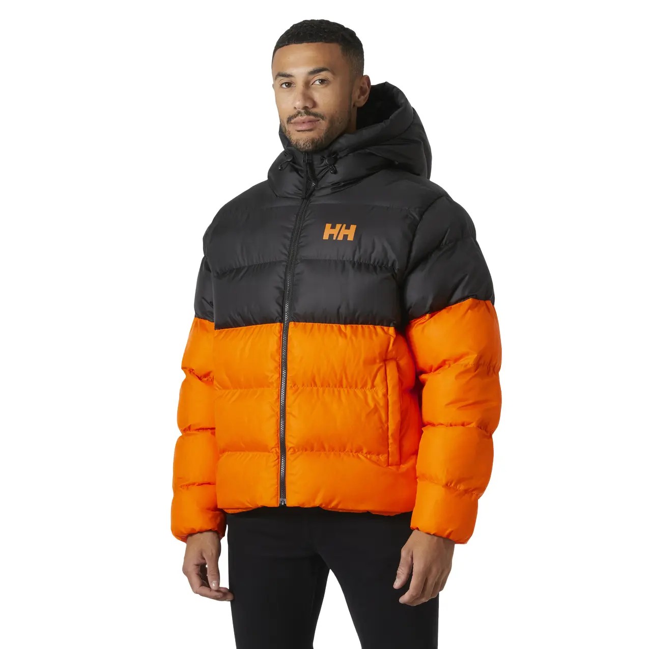 Black and orange puffer jacket featuring a hood, quilted design, and Helly Hansen logo on the chest, ideal for active outdoor wear.