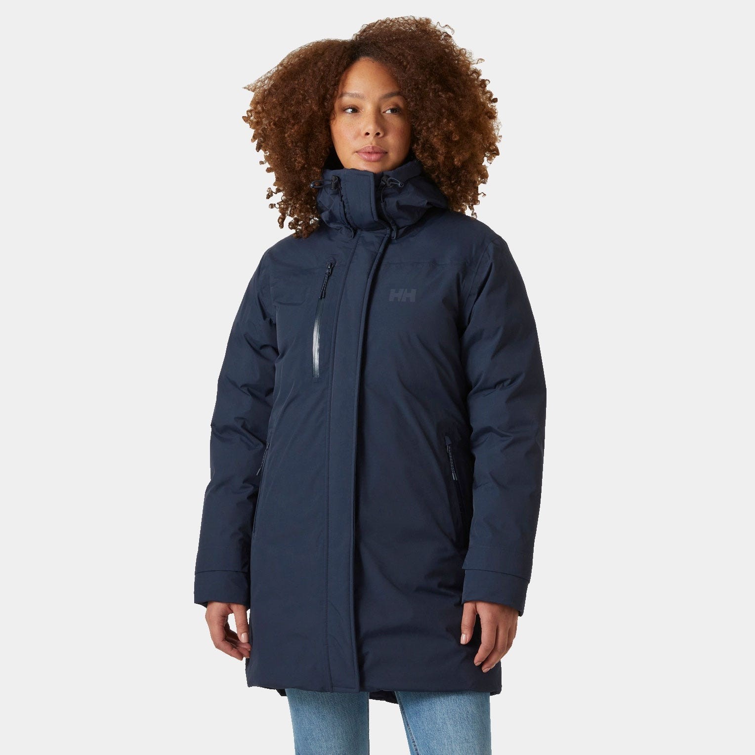 Navy blue women's parka by Helly Hansen, featuring a zippered front, high collar, and a logo on the chest, made from a durable, insulated material.