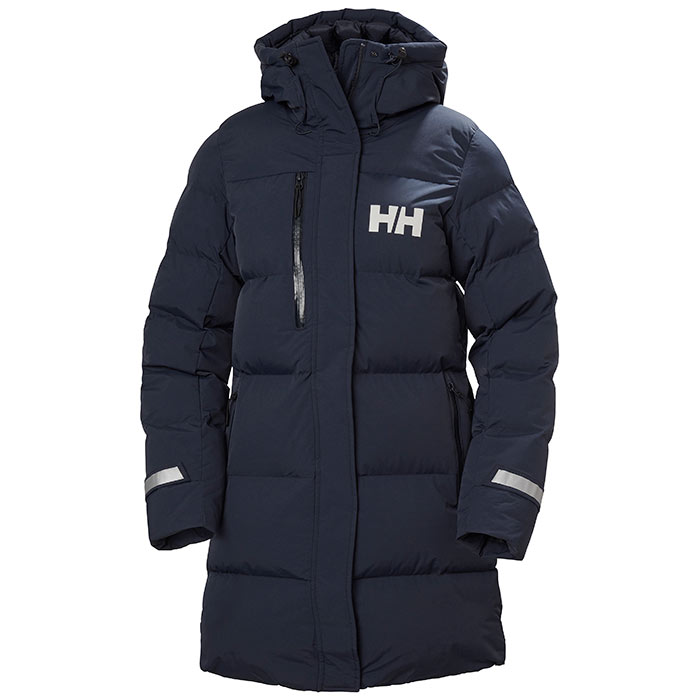 Navy long jacket by Helly Hansen, featuring a puffy design, zippered front, hood, and reflective details, with the brand logo prominently displayed on the chest.