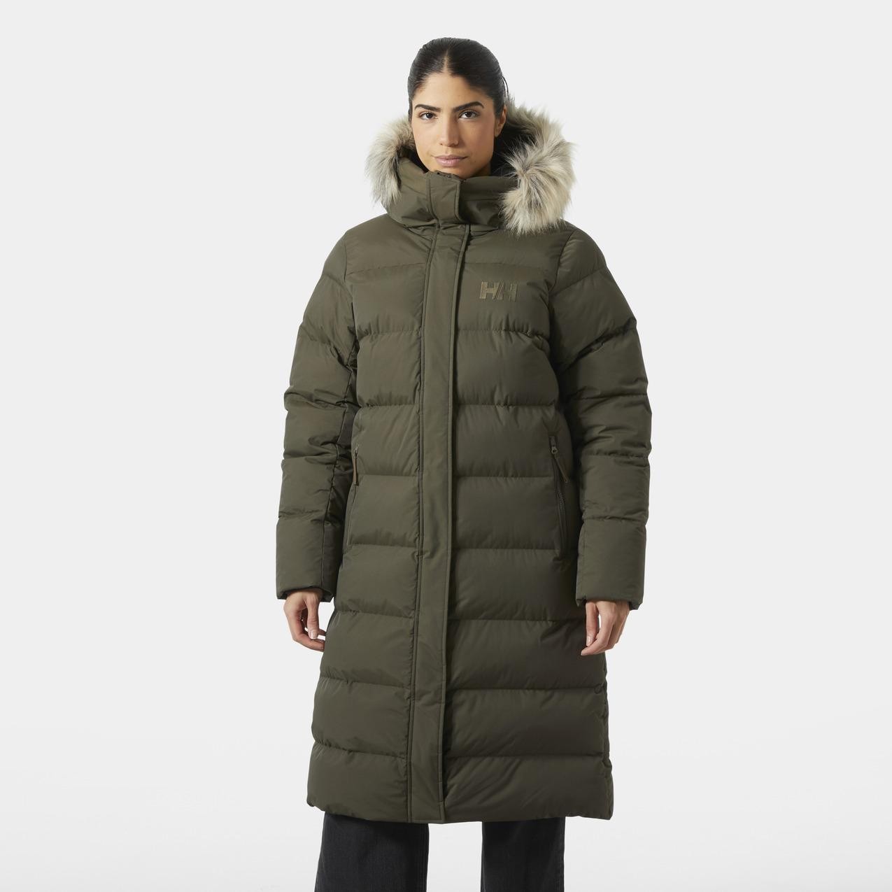 Olive green women's parka by Helly Hansen, featuring a fur-lined hood, quilted design, and a mid-length cut, ideal for warmth and style in cold weather.