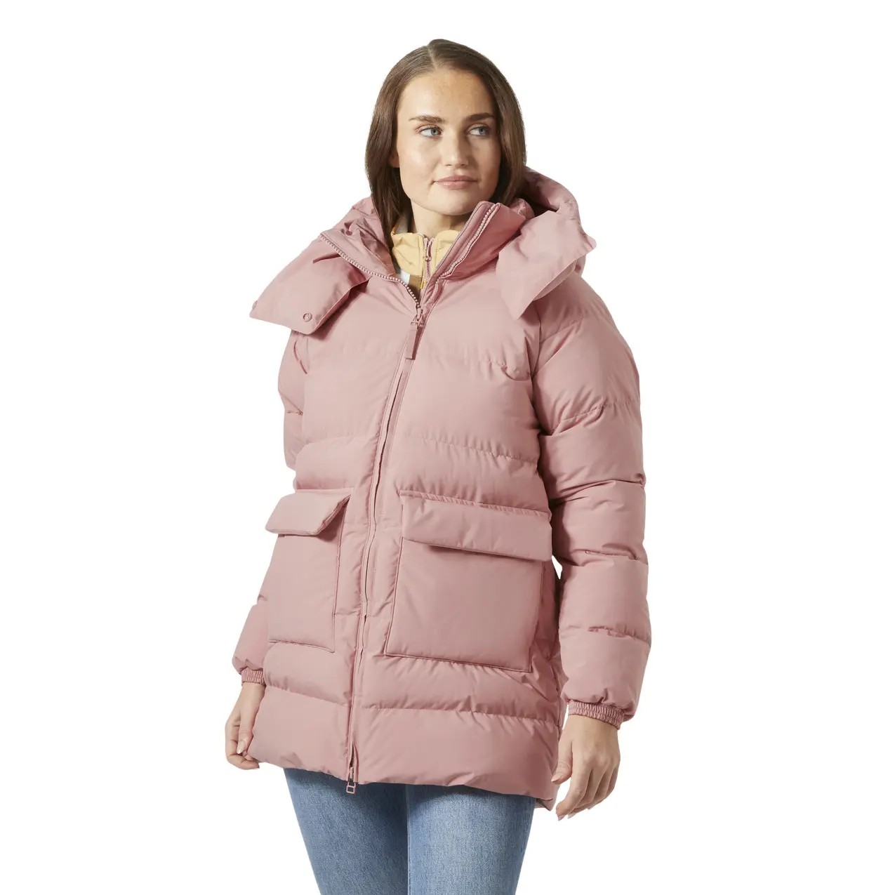 Light pink women's hooded parka by Helly Hansen, featuring a puffy design, front pockets, and a high collar, perfect for warmth and style in cold weather.