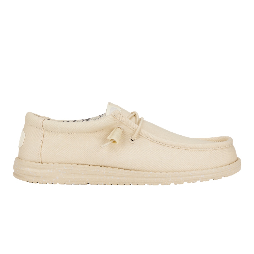 Men's Wally Canvas Shoe by HEYDUDE in Stone White, featuring a soft canvas upper, lace-up design, and a flexible rubber sole for comfort.