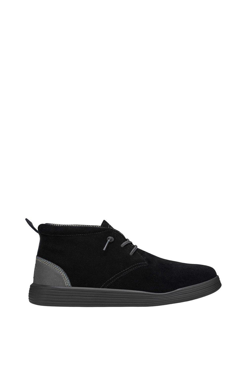 Unisex HEYDUDE Jo Boot in Jet Black features a soft suede upper, contrasting grey accents, a lace-up design, and a flexible rubber sole for comfort.