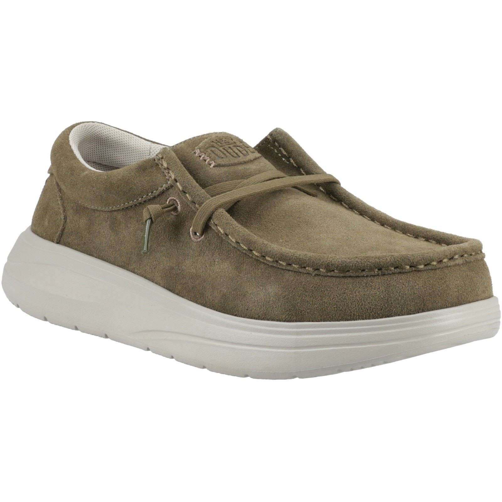 Green suede slip-on shoes with a rounded toe, stitched detailing, and a cushioned white sole, featuring a lace-up design and HEYDUDE branding on the tongue.