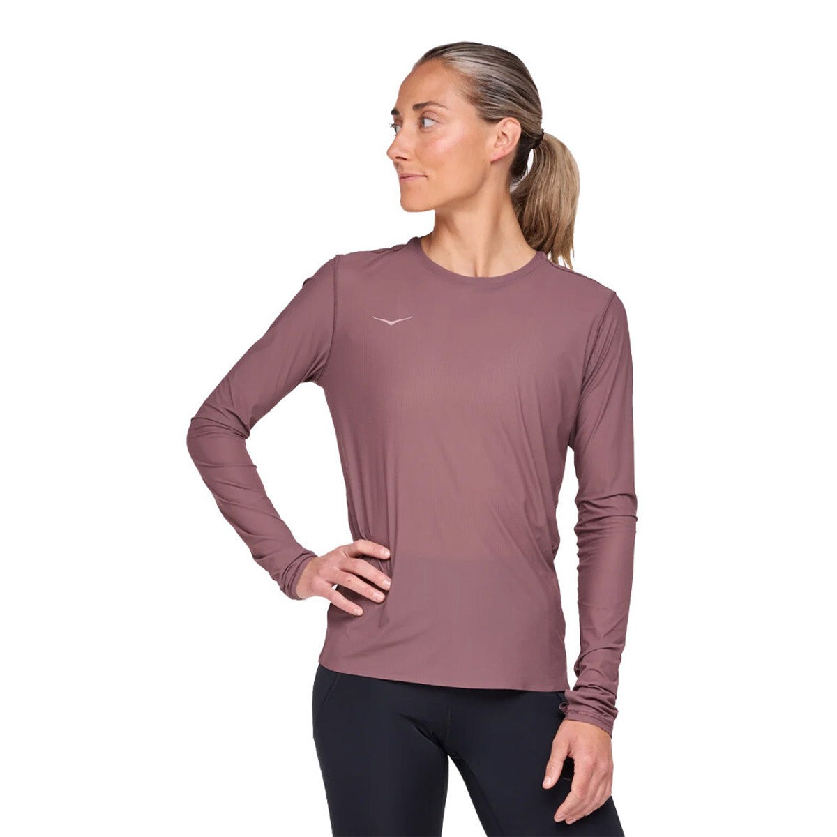 Long-sleeve women's running shirt in smokey quartz pink, featuring a lightweight, breathable fabric and a fitted silhouette, ideal for active wear.