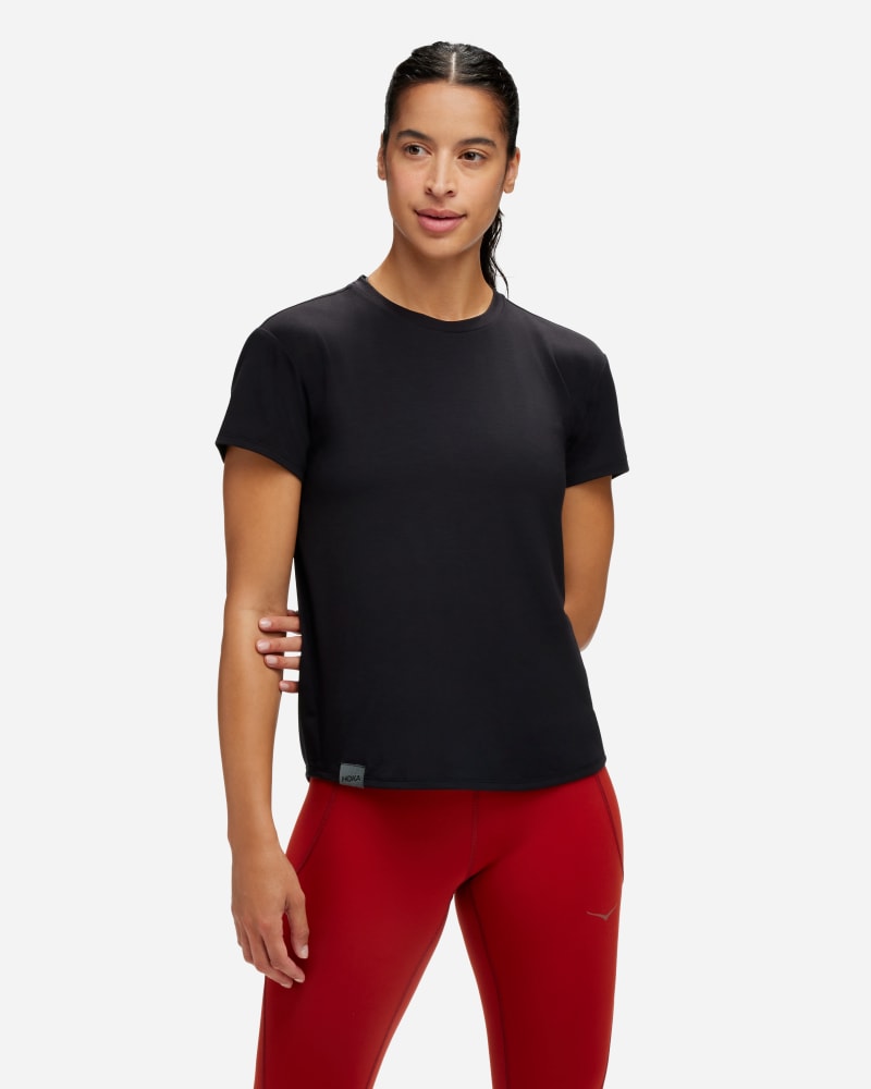 Black women's Hoka Essential T-Shirt in size small, featuring a classic crew neck, short sleeves, and a soft, lightweight fabric for comfort.