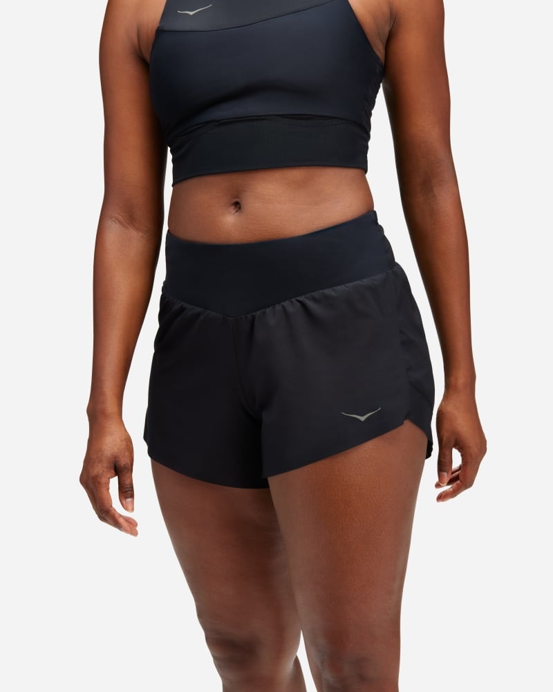 Black women's HOKA Glide shorts made from lightweight material, featuring a comfortable waistband and a subtle logo on the front, designed for active wear.