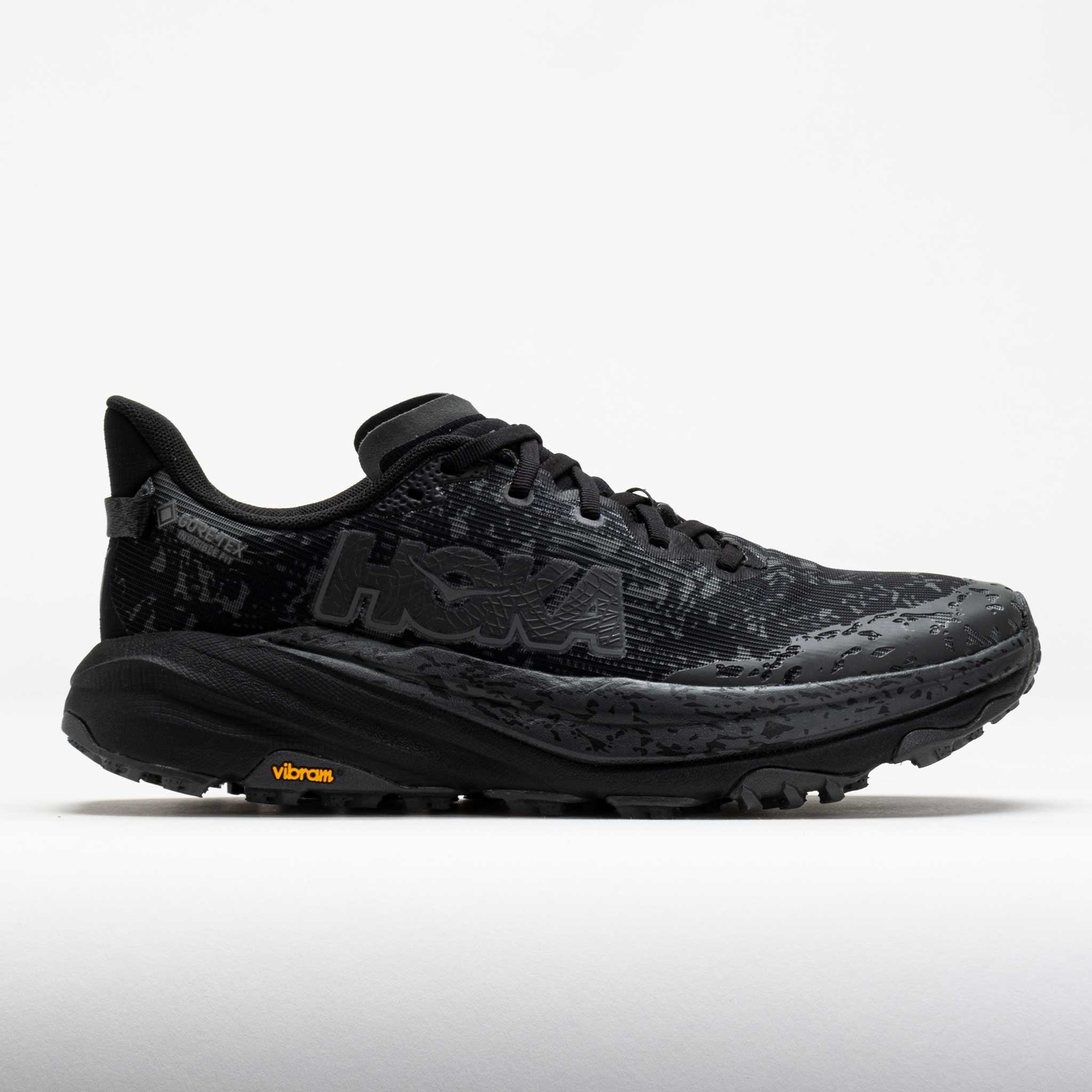 HOKA Men's Speedgoat 6 GORE-TEX Trail Shoes in black with textured upper, featuring a prominent logo, Vibram outsole, and cushioned sole, size 11 W.