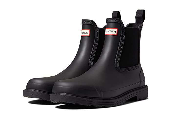 Black Hunter Commando Chelsea boots for women, size 4 UK, featuring a sleek rubber design, elastic side panels, and signature logo on the front.