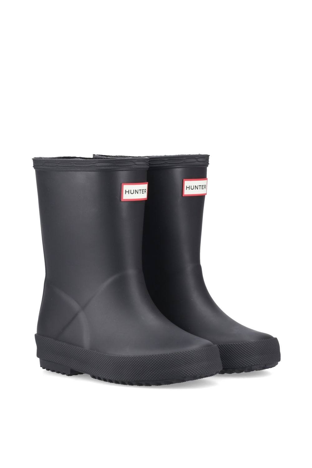 Black matte rubber Wellington boots for kids, featuring a sturdy sole and red Hunter logo on the front, designed for durability and comfort in wet conditions.