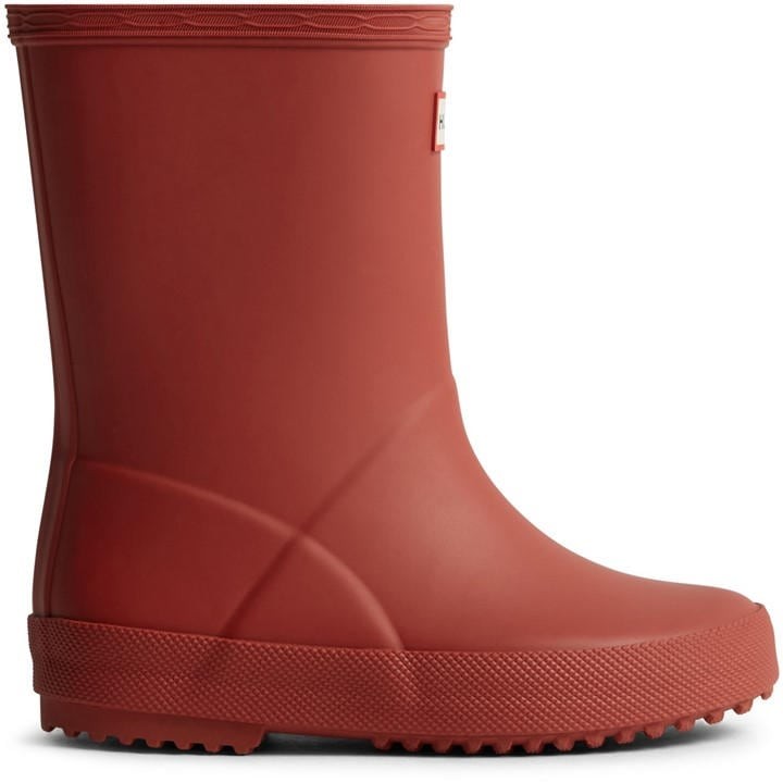 Bright red rubber Wellington boot for kids, featuring a textured sole for grip and a smooth finish, designed for comfort and waterproof protection.