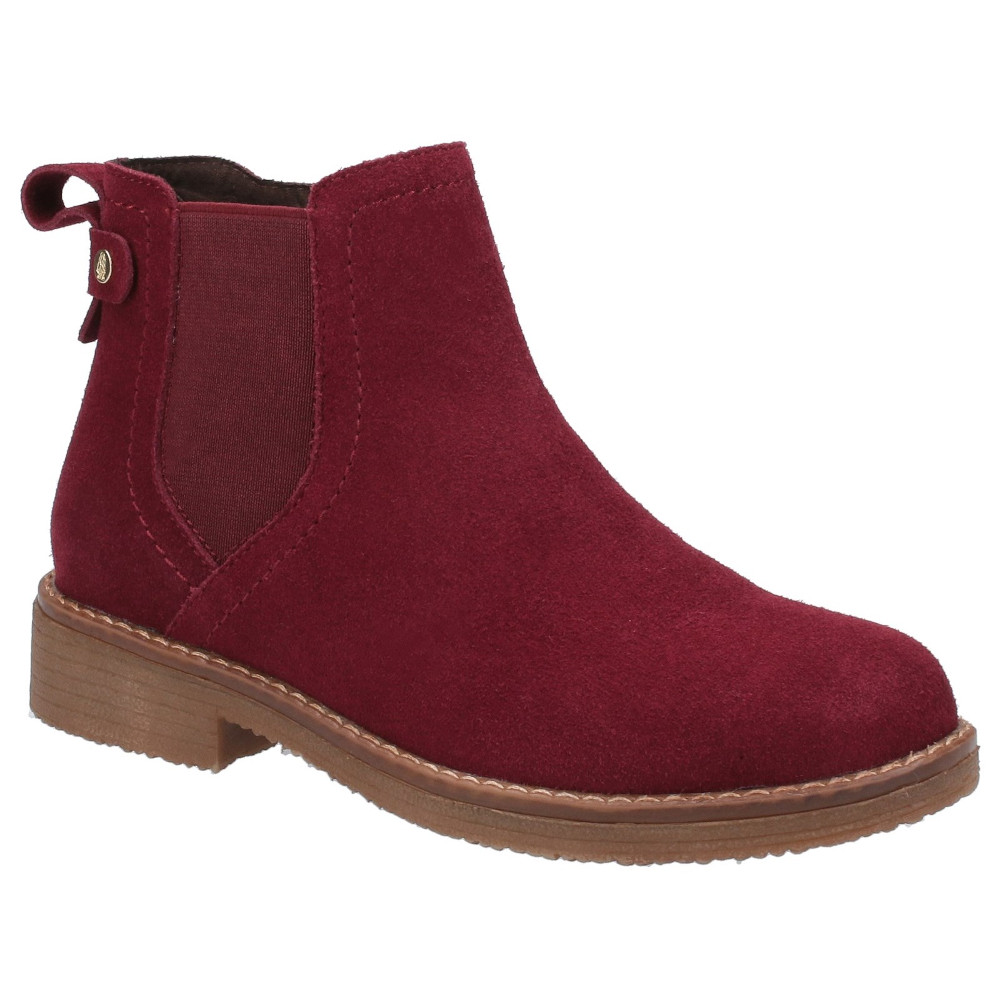 Red suede ankle boots with elastic side panels, a small heel, and a decorative button detail on the back, designed for women by Hush Puppies.