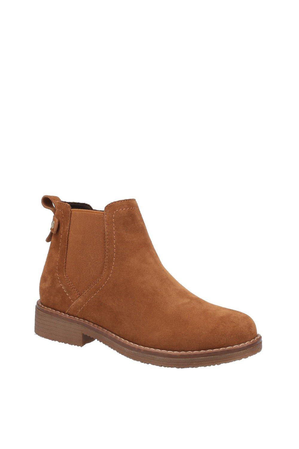 Brown suede ankle boots with a smooth finish, featuring a side pull tab, stitched detailing, and a low stacked heel for added style and comfort.