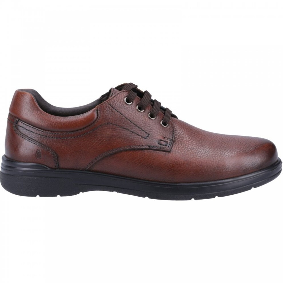Brown leather lace-up shoe with a textured finish, featuring a rounded toe, contrasting black sole, and subtle stitching details for a classic look.