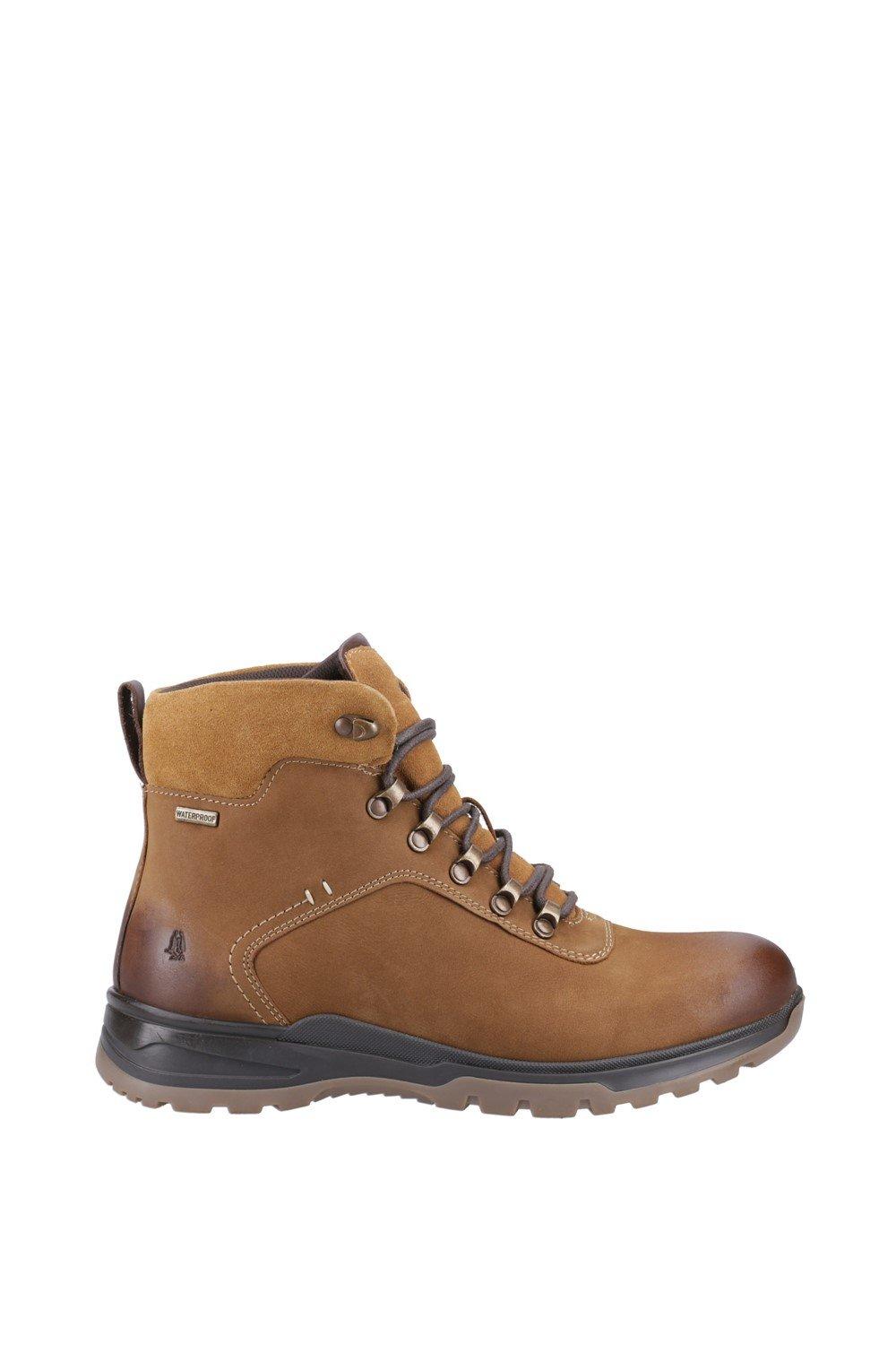 Tan leather ankle boot featuring a lace-up front, padded collar, and rubber sole, designed for comfort and durability.