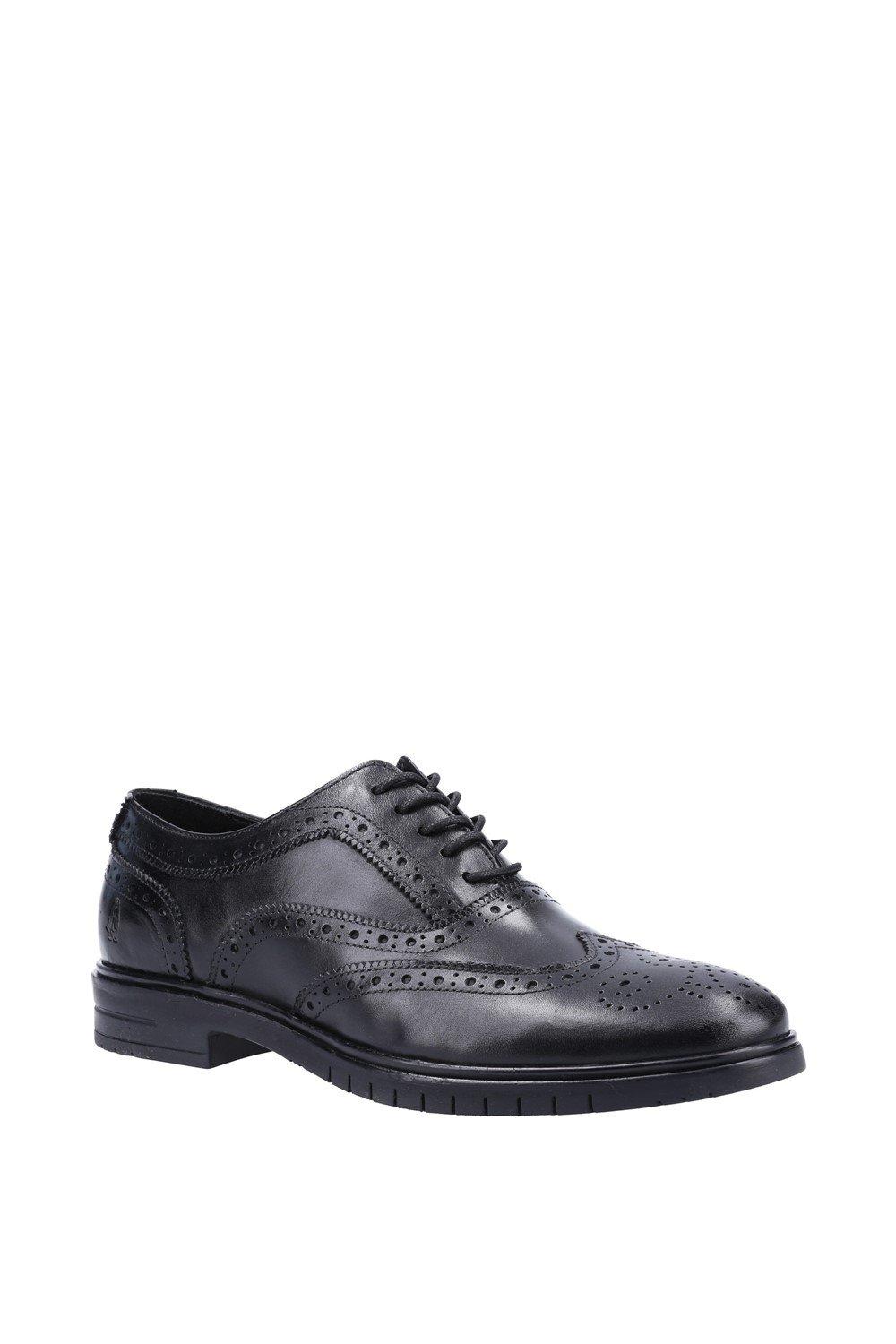 Black smooth leather lace-up shoes featuring brogue detailing and a sturdy sole, designed by Hush Puppies in size 6.
