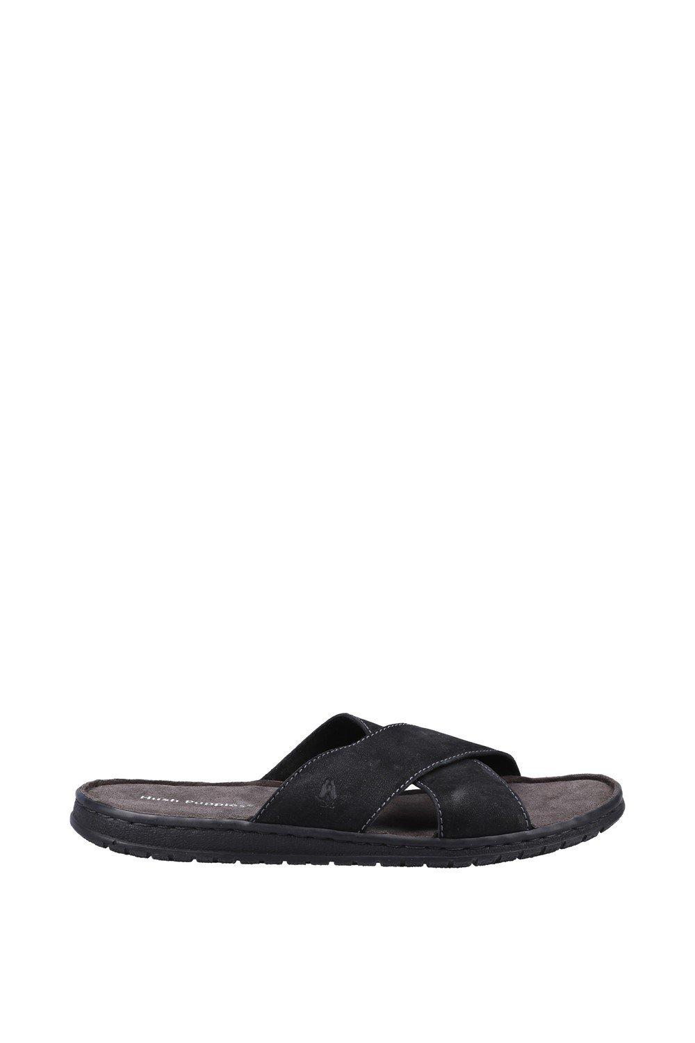 Black Hush Puppies 'Nile Cross Over' sandals featuring a cross-strap design, soft suede material, and a cushioned footbed, available in size 6.