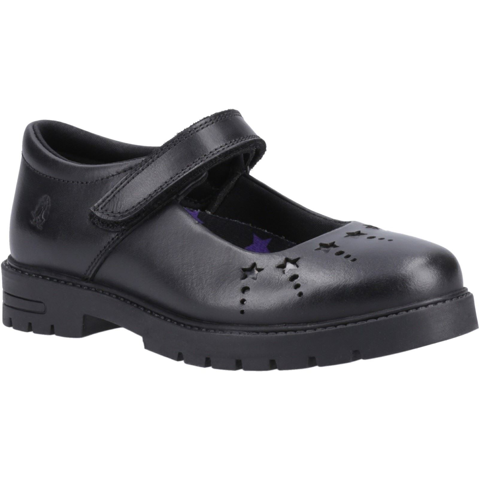 Black leather Mary Jane shoes with a Velcro strap, featuring star cutouts on the toe and a sturdy rubber sole, designed for youth by Hush Puppies.