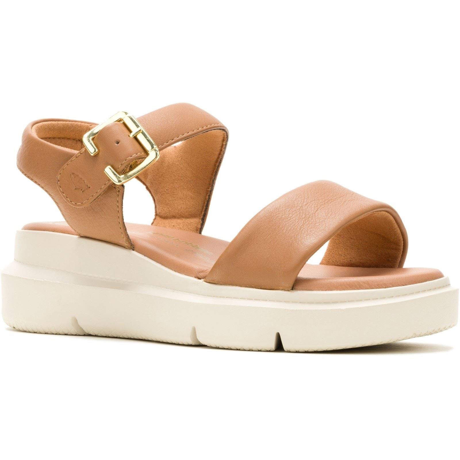 Tan leather women's sandals featuring a wide front strap, adjustable ankle buckle, and a thick white platform sole for added comfort.