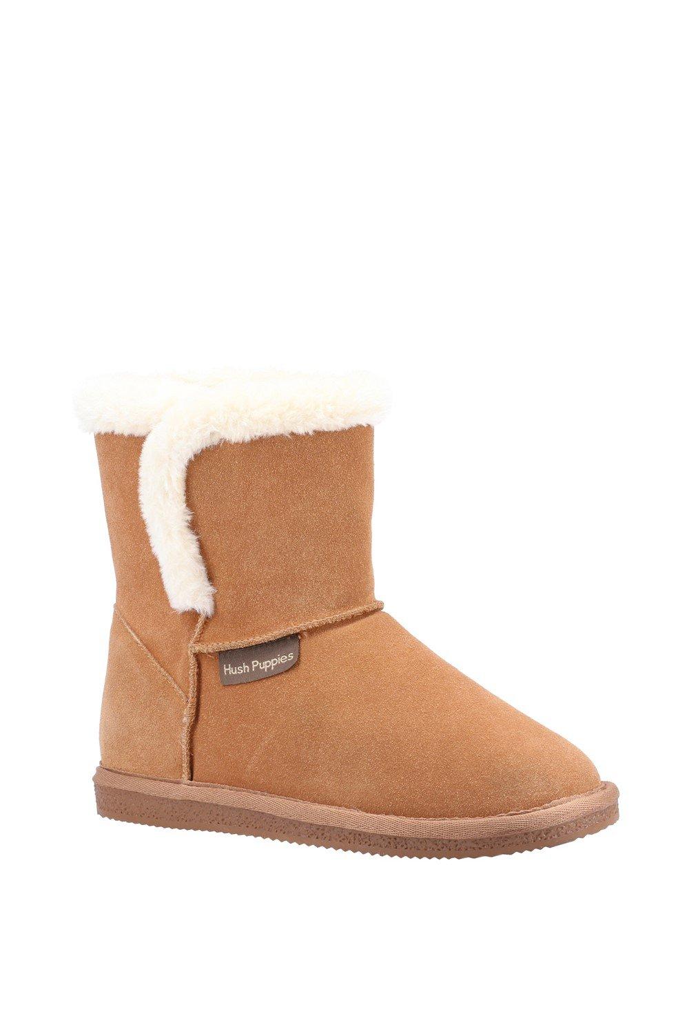 Tan classic slippers featuring a soft faux fur cuff, suede-like material, and a rubber sole, designed for comfort and warmth.