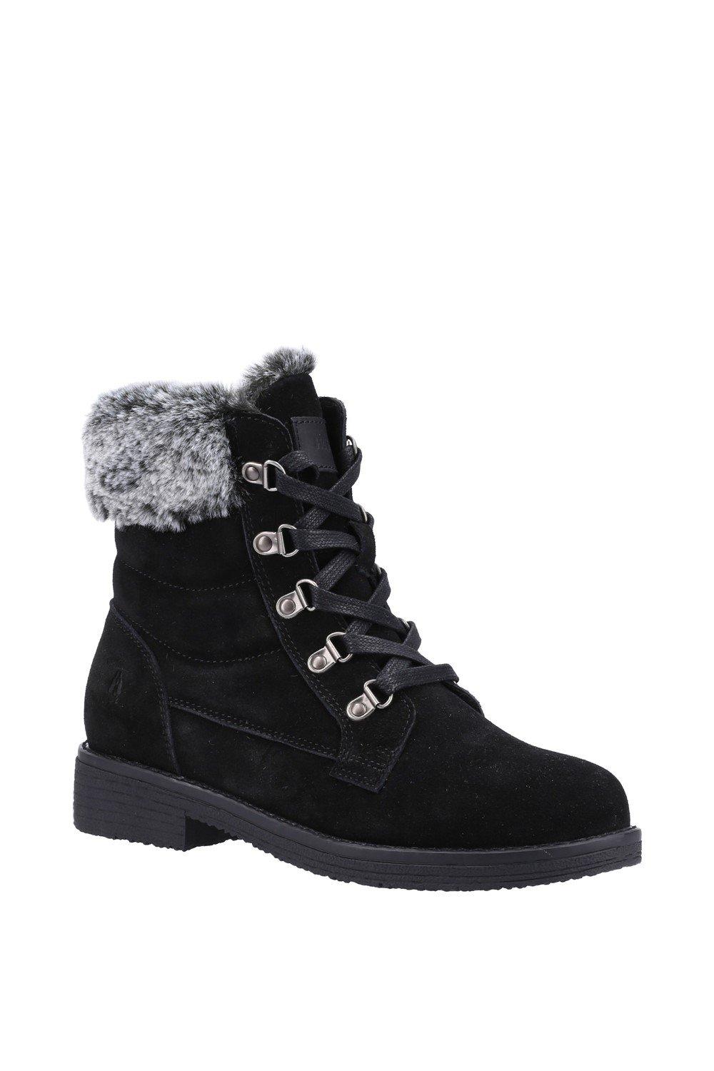 Black mid boot by Hush Puppies featuring a suede exterior, faux fur collar, lace-up front with silver eyelets, and a sturdy rubber sole.