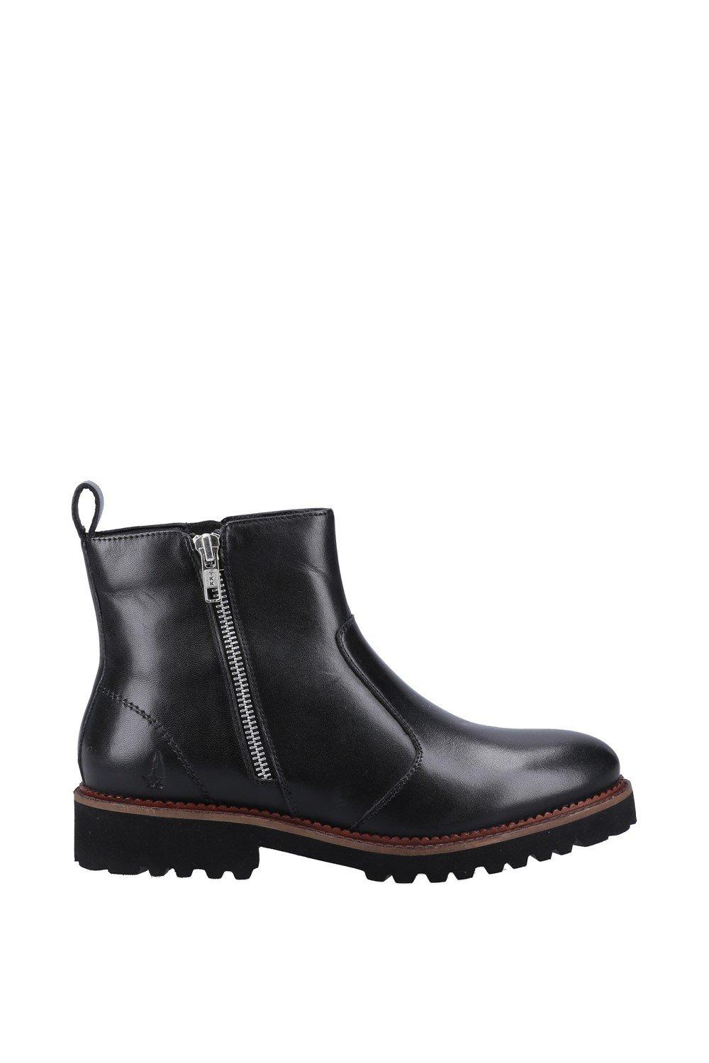 Black leather ankle boots featuring a side zipper, round toe, and a rugged sole, designed for comfort and style by Hush Puppies.