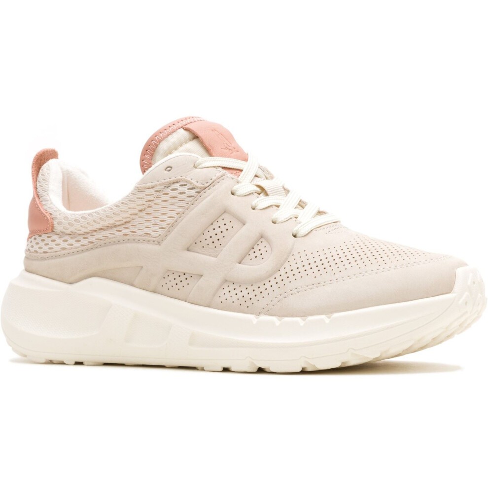 Light stone-colored athletic shoes with a mesh upper, featuring a pink heel accent and a thick white sole, designed for comfort and style.