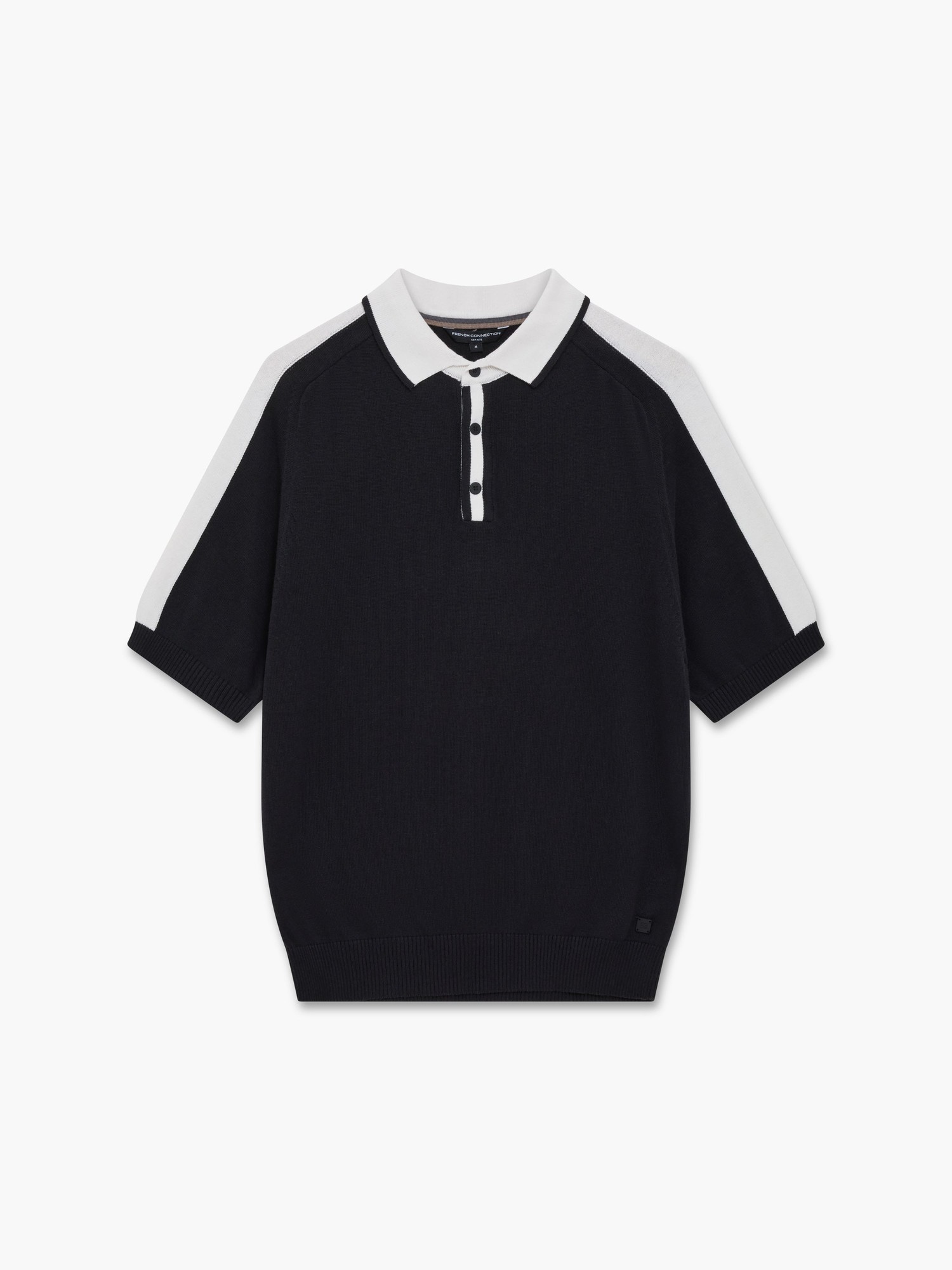 Short-sleeve polo in navy with contrasting white shoulder panels, featuring a buttoned placket and ribbed hem, made from a soft knit material.