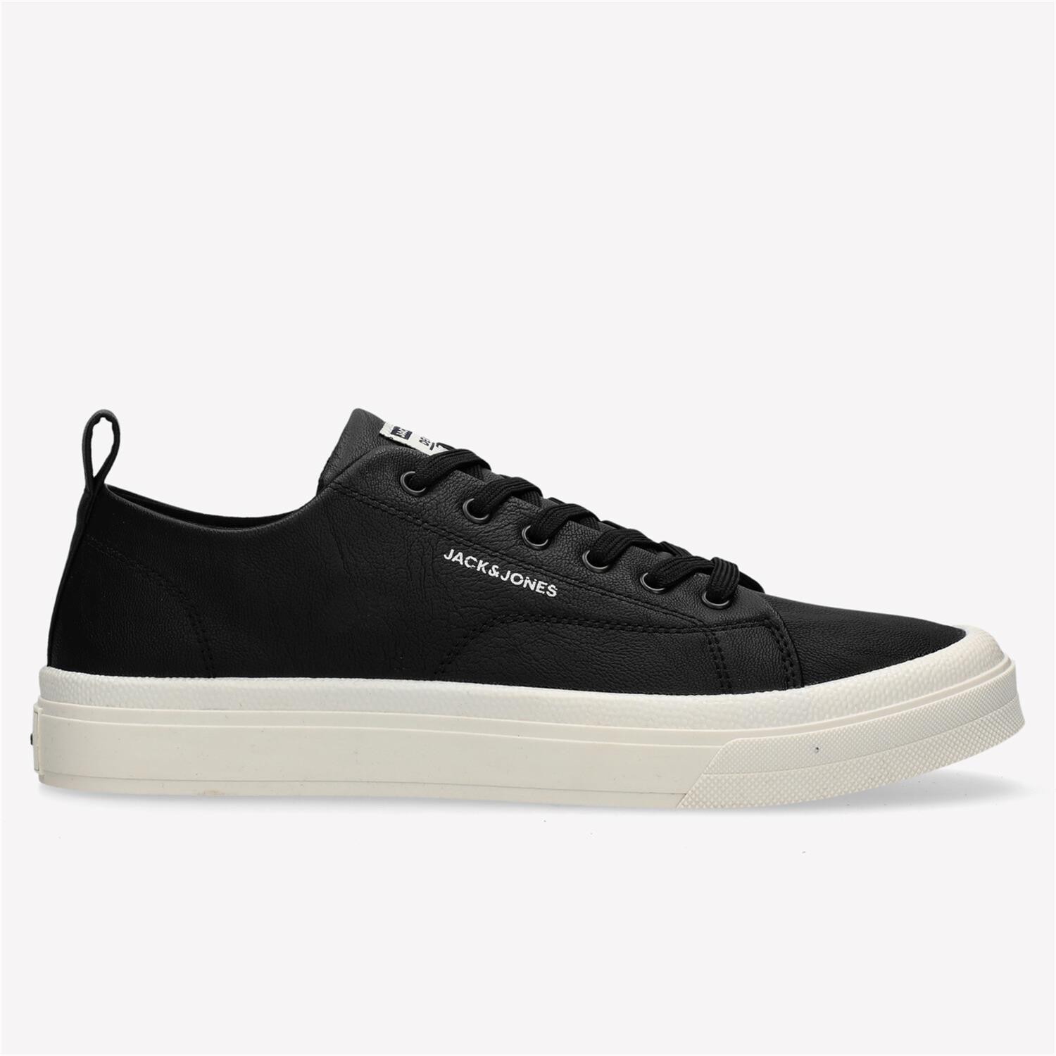Men's anthracite trainers by Jack & Jones, featuring a sleek black polyurethane upper, white rubber sole, and classic lace-up design with a pull tab at the heel.