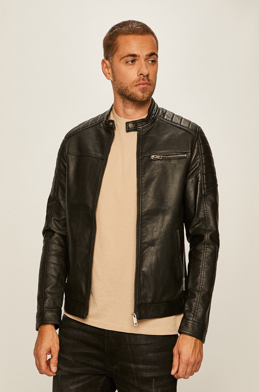 Black leather Rocky Jacket by Jack & Jones featuring a stand-up collar, zippered chest pocket, and quilted shoulder detailing, worn over a beige shirt.
