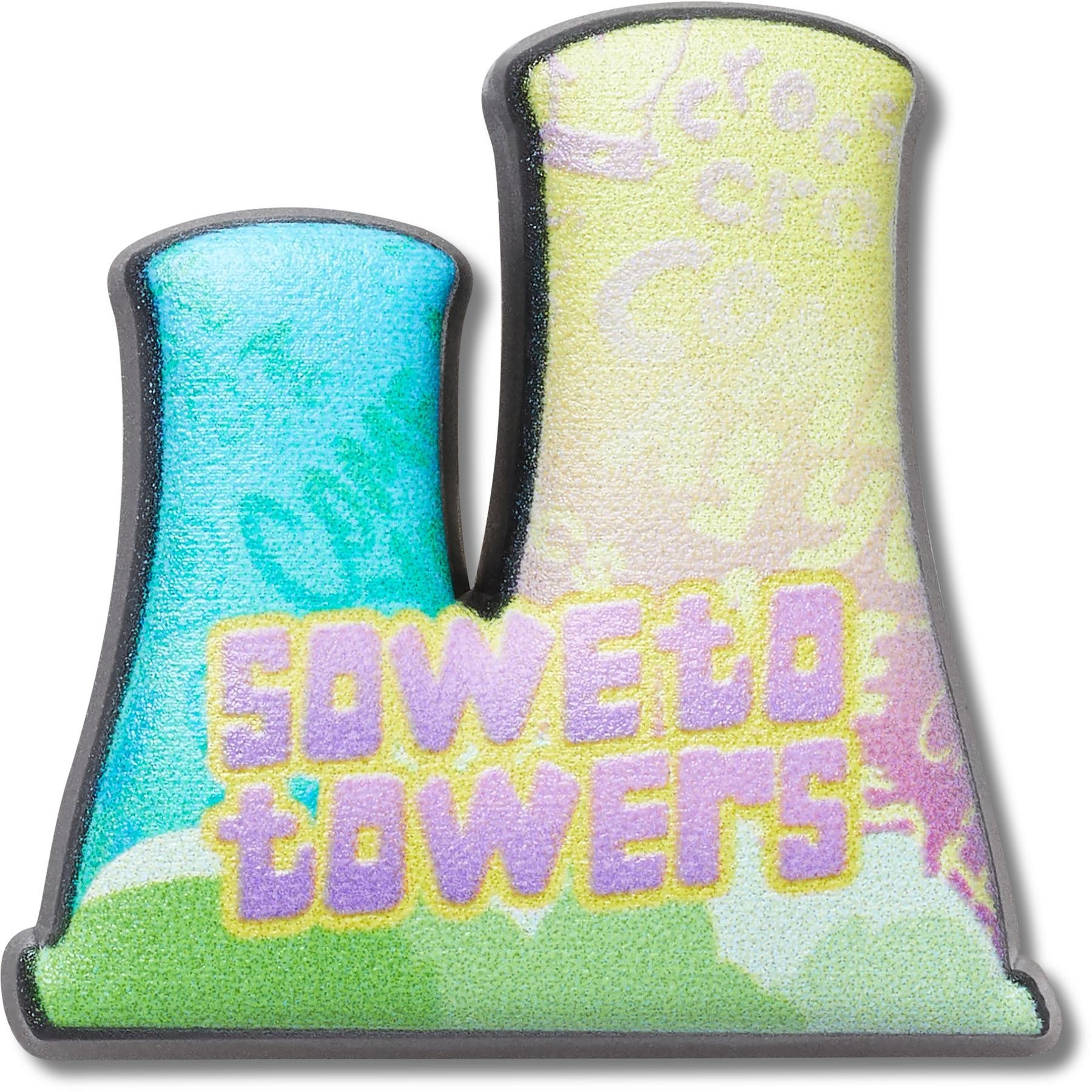 Colorful Jibbitz charm shaped like the Soweto Towers, featuring a glossy finish with blue and yellow sections, and the text "SOWETO TOWERS" in bold purple letters.