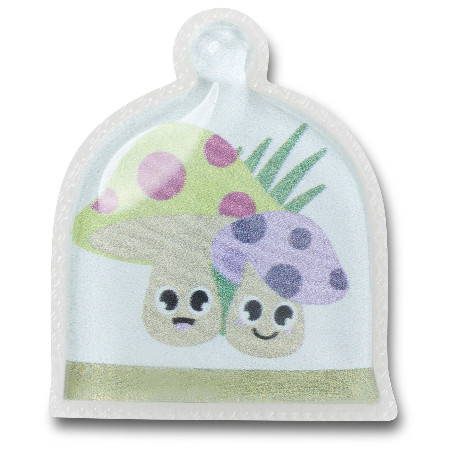 Colorful Jibbitz charm featuring two cartoon mushrooms with polka dots, set in a clear, dome-shaped casing with a light green base and green grass accents.