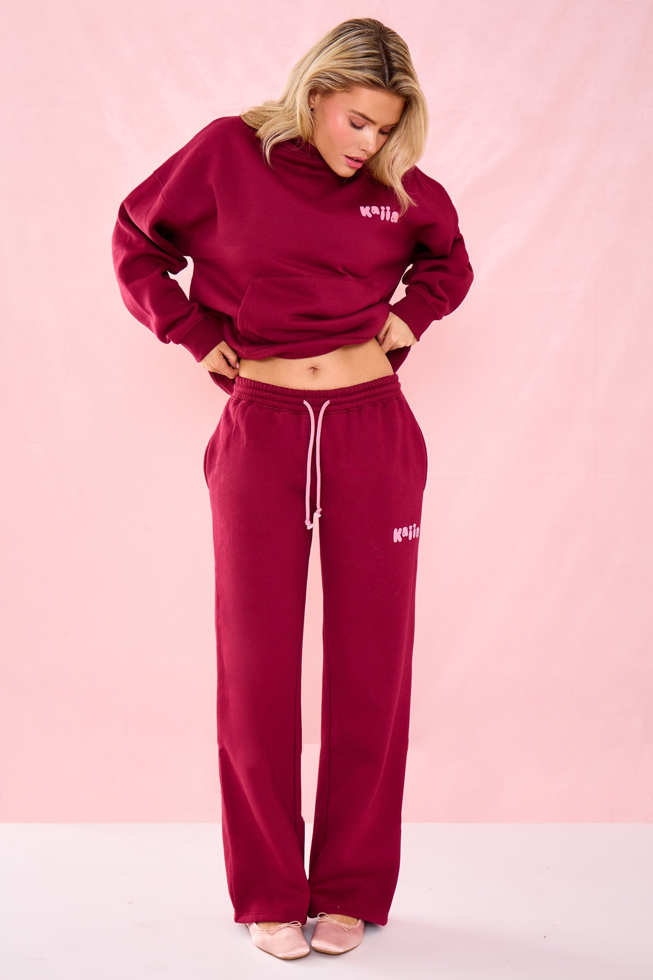 Raspberry jelly wide leg joggers made from soft material, featuring an elastic waistband with drawstring and subtle bubble graphic detailing.