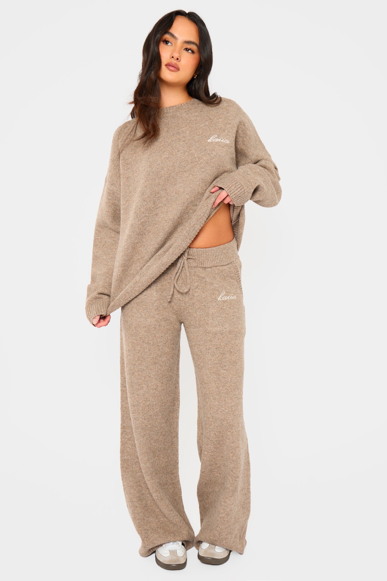 Taupe marl wide-leg trousers by Kaiia feature a drawstring waist, soft fabric, and a relaxed fit, styled with a matching oversized sweater.