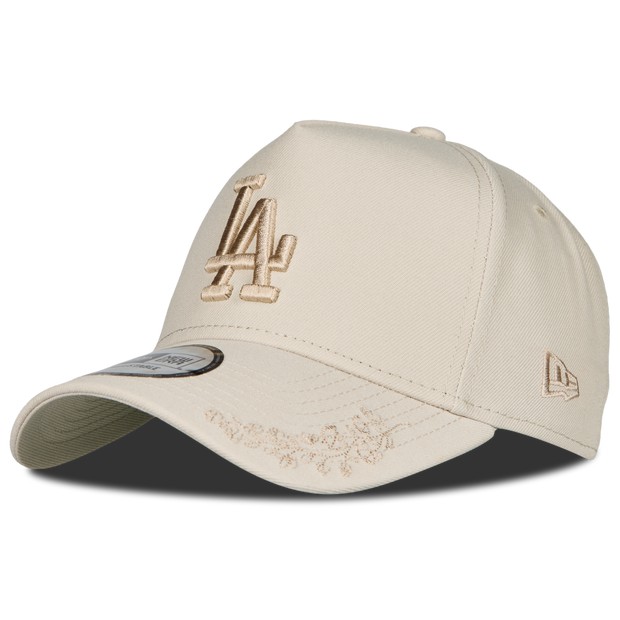 Cream-colored Dodgers baseball cap featuring a tonal LA logo embroidered on the front and a curved brim, made from durable fabric with a structured fit.