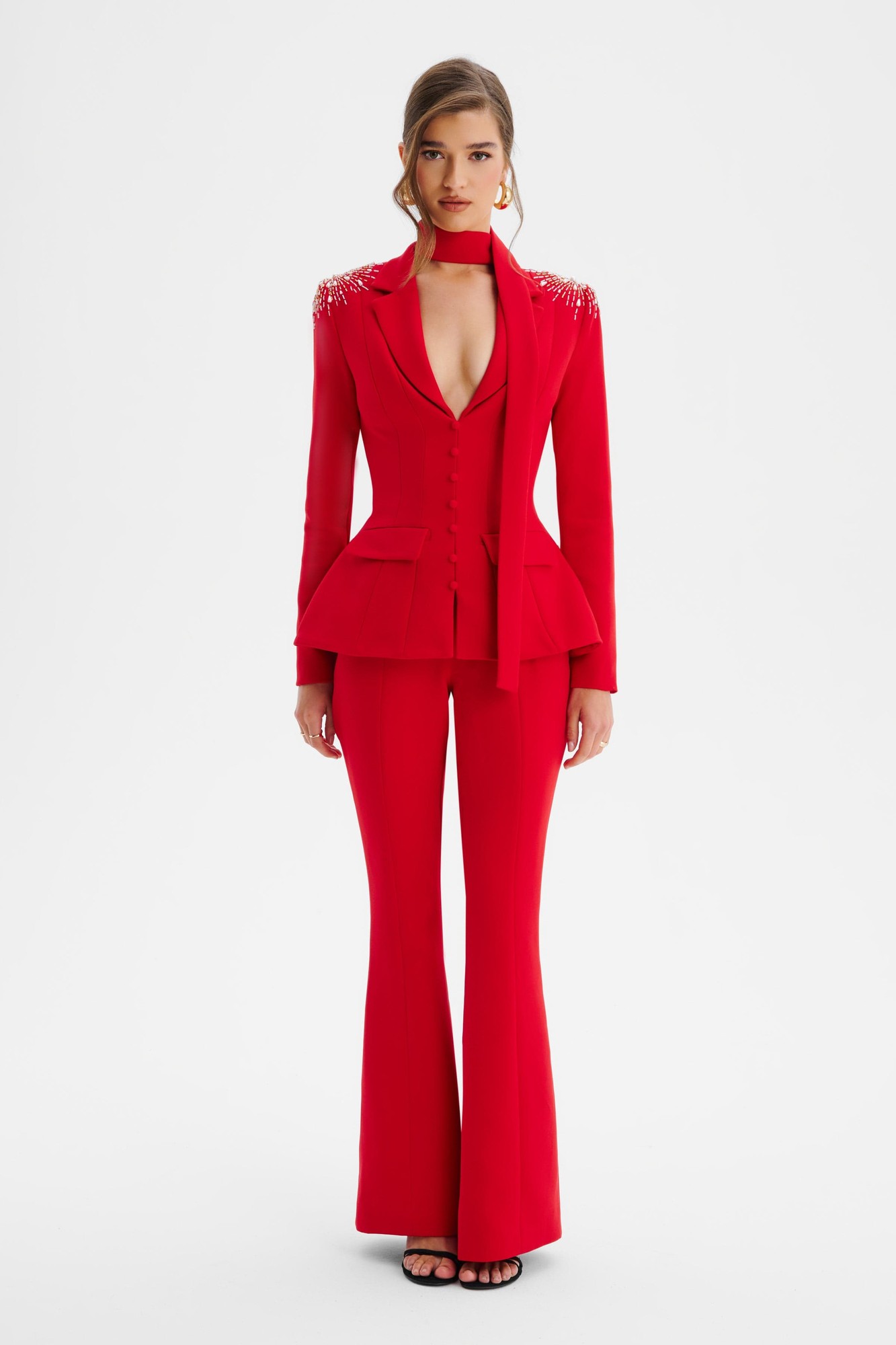 Red shoulder hand-embellished sculptured blazer jumpsuit featuring a deep V-neck, fitted waist, peplum detail, and flared pants, designed by Lavish Alice in size XL UK16.