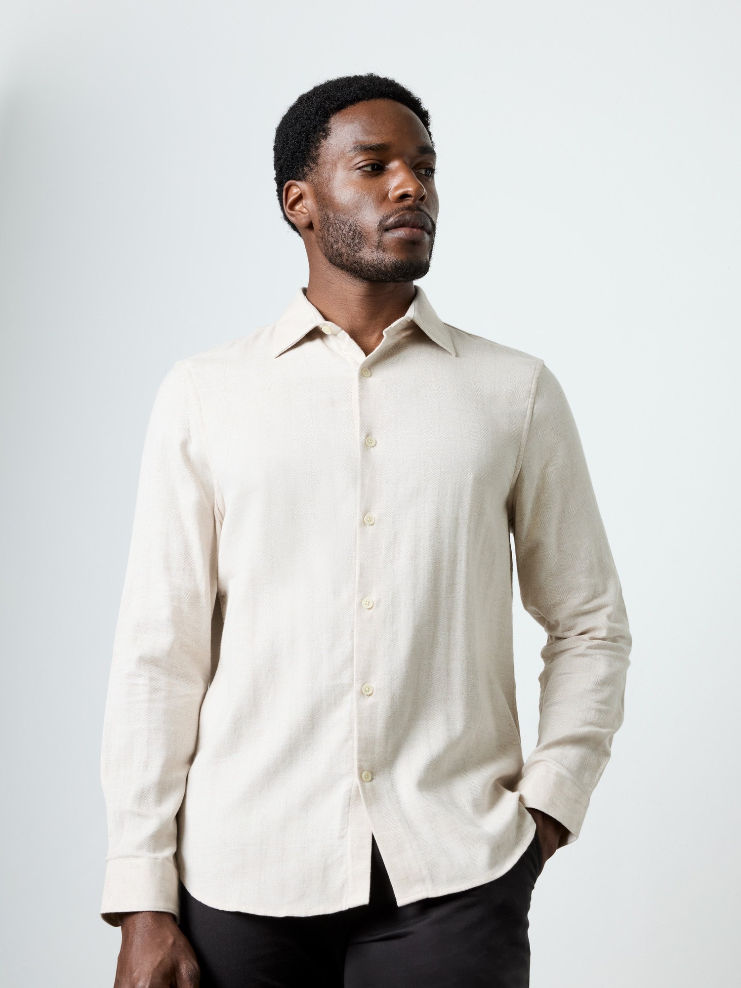 Light stone-colored long-sleeve shirt with a regular fit, featuring a button-down front and a classic collar, made from a soft, textured fabric.