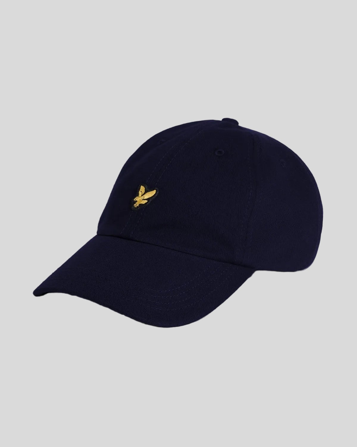 Navy blue baseball cap made of cotton, featuring a curved brim and an embroidered golden Lyle & Scott logo on the front.