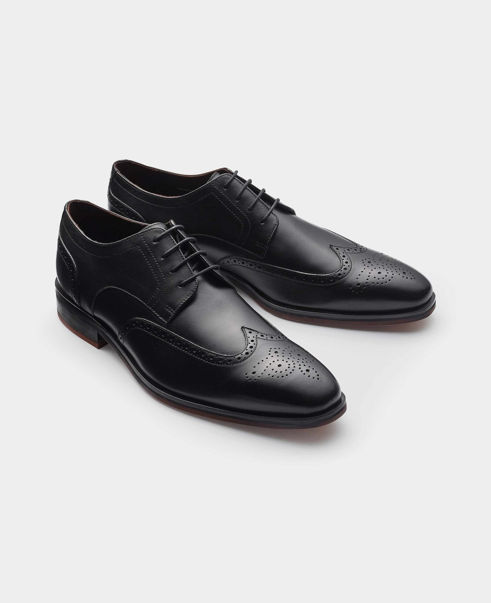Men's black leather brogue derby shoes featuring intricate perforated detailing, a classic lace-up design, and a sleek silhouette, available in size 9 from Savile Row Company.