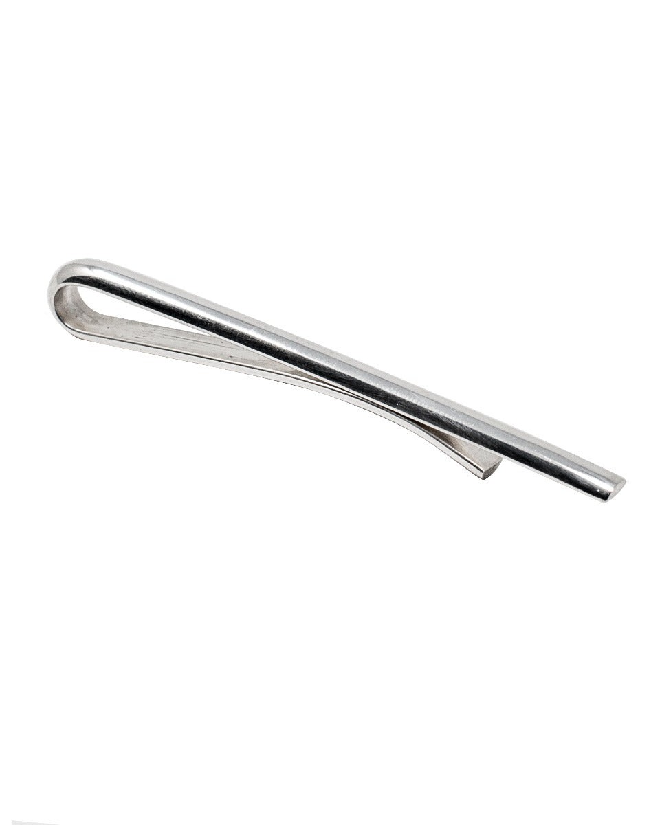 Sleek men's tie clip made of polished sterling silver, featuring a minimalist design with a curved top and a flat bottom for secure attachment.