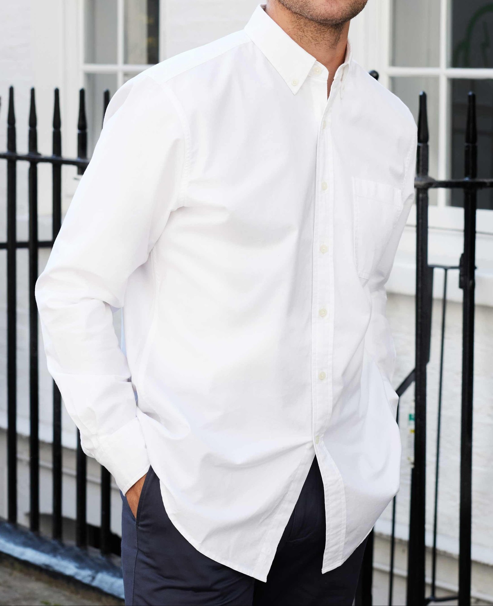 Classic fit men's white Oxford shirt in medium extra long size, featuring a button-down collar and a chest pocket, made from a crisp cotton material.
