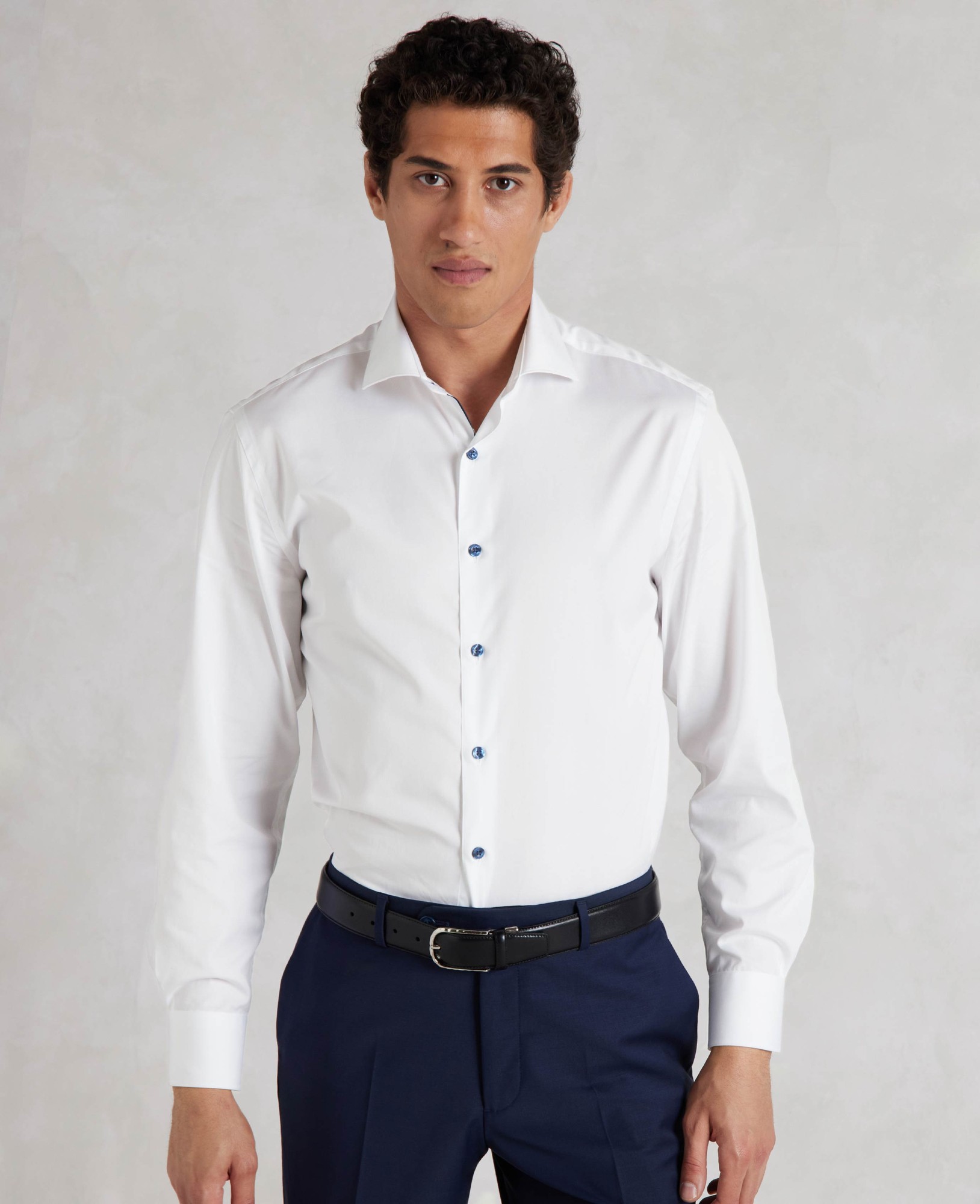 Men's white slim fit smart-casual shirt featuring contrast blue buttons, single cuffs, and a tailored design, available in size XL Extra Long.