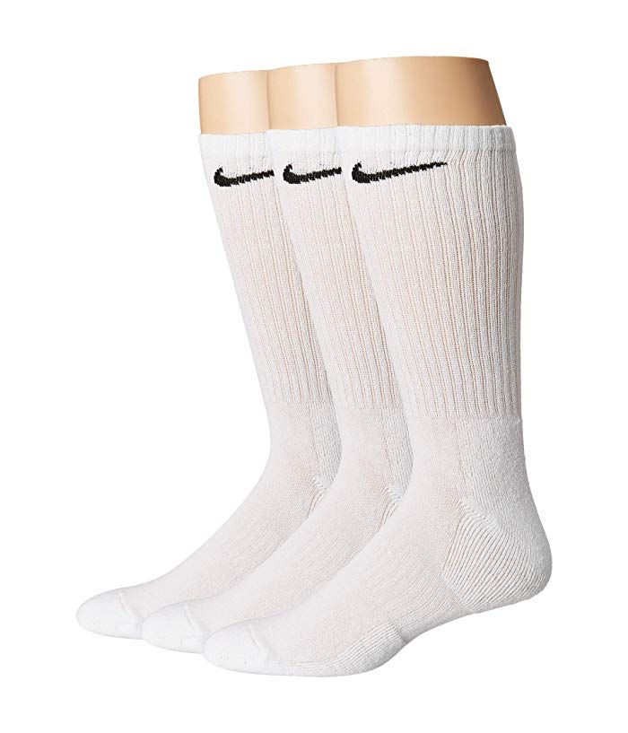 Three pairs of white Nike Everyday Cushion Crew socks featuring black Nike logos, ribbed texture, and cushioned soles, designed for unisex adults.