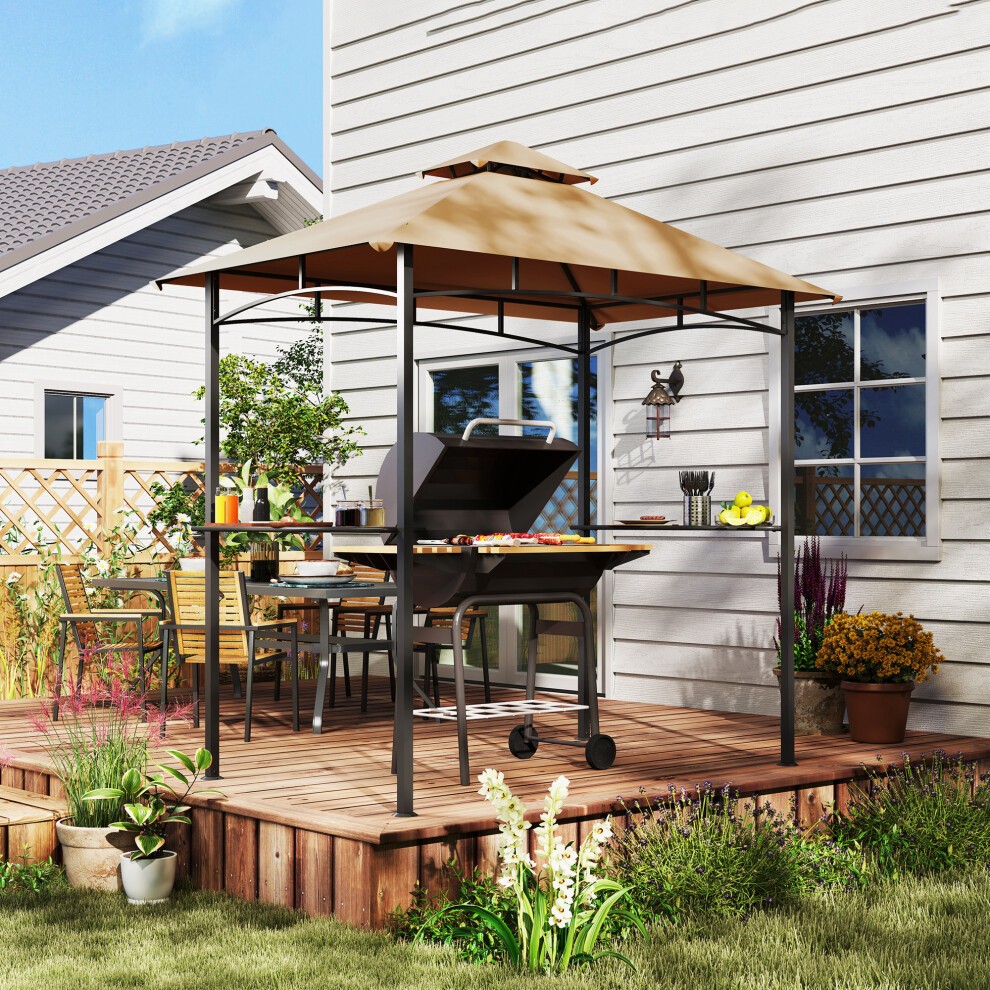 Double-tier outdoor BBQ gazebo with a beige canopy, black metal frame, and a grill underneath, set on a wooden deck surrounded by plants and a house in the background.